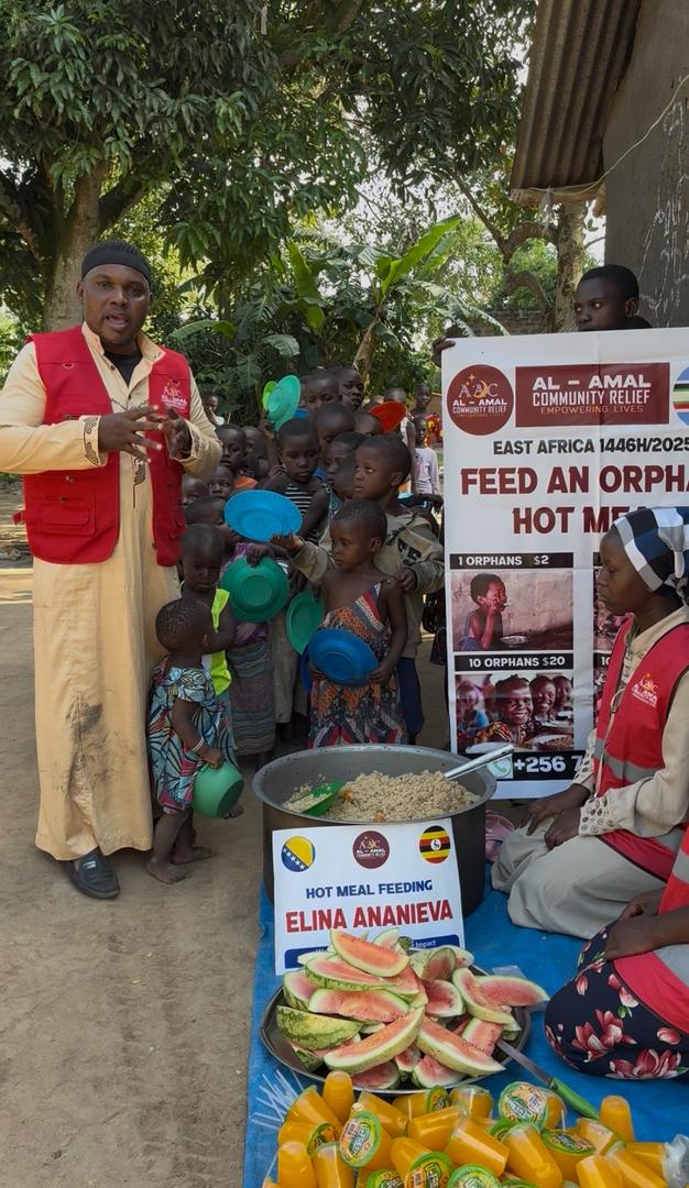 Al Amal Community Relief volunteers serving food to children in Mbale